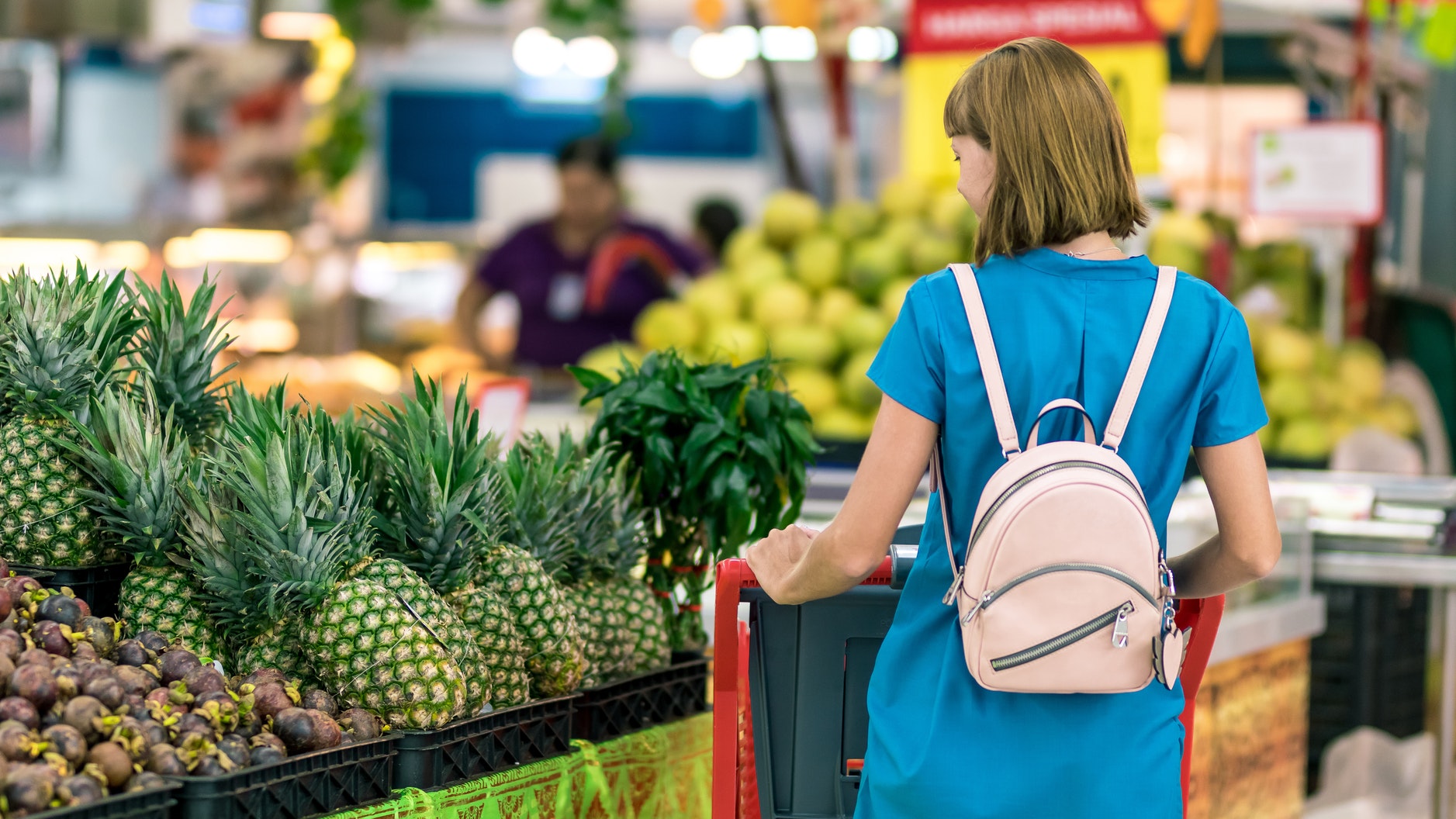 woman looking at produce