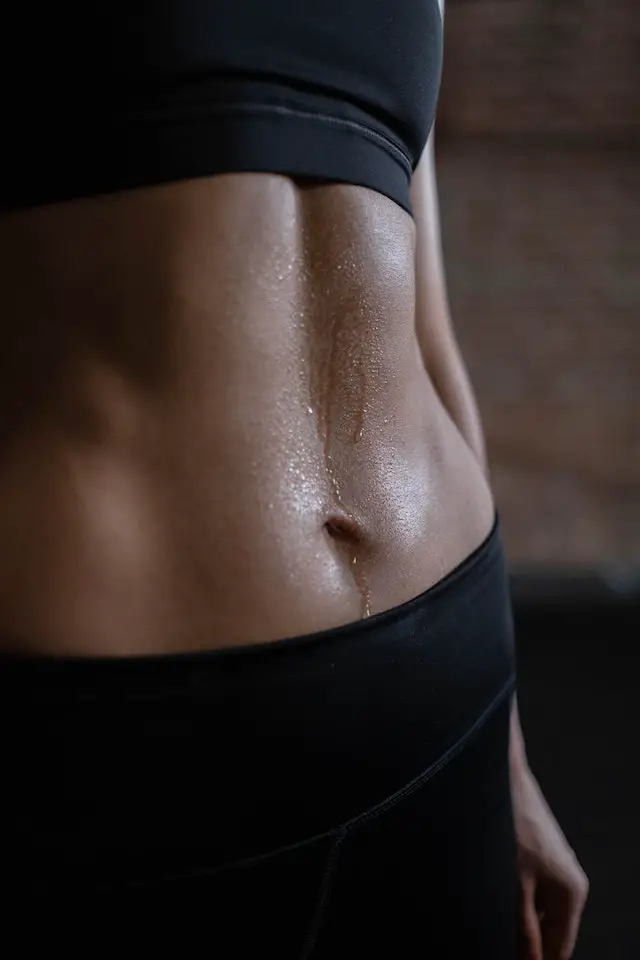 Close-up of a person’s abs.